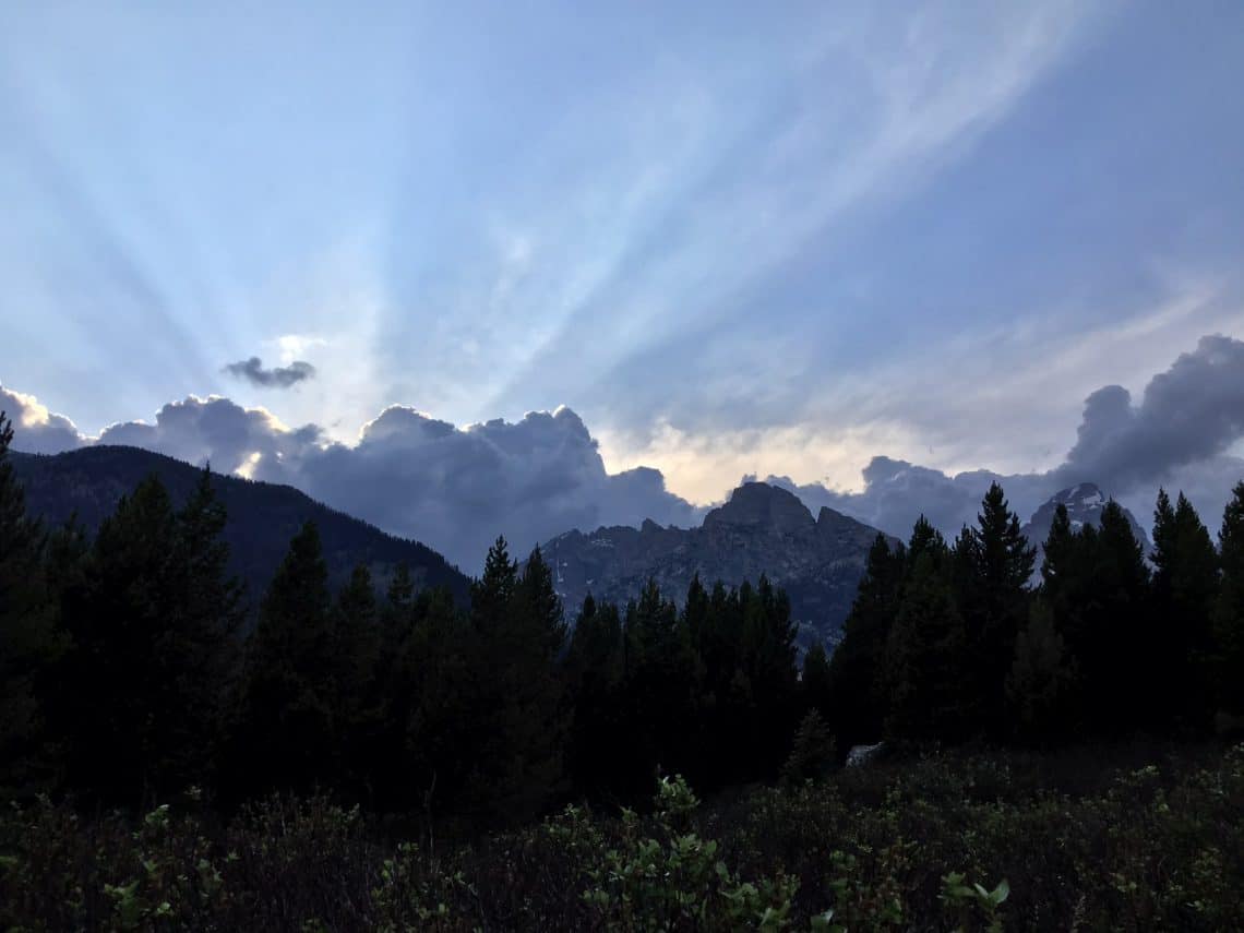 Sun coming over mountains.