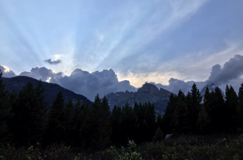 Sun coming over mountains.