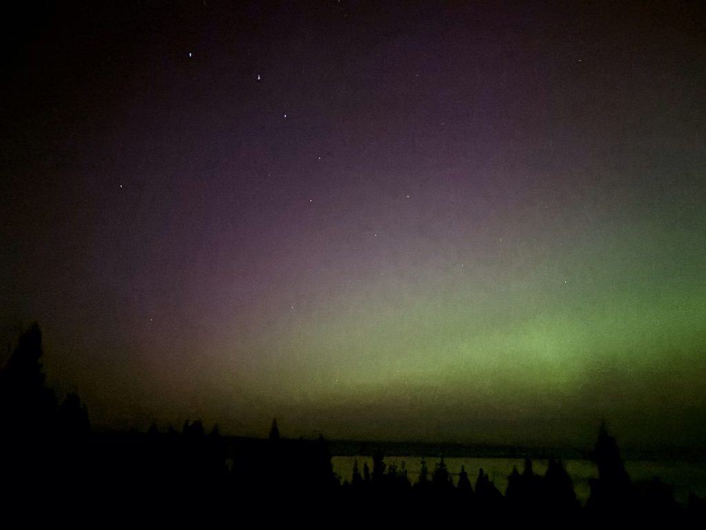 Aurora Borealis with Ursa Major over lake.